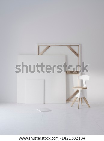 Pictures and chair in white studio with atmospheric lighting