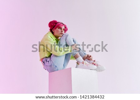 woman in green jacket sits fashion style