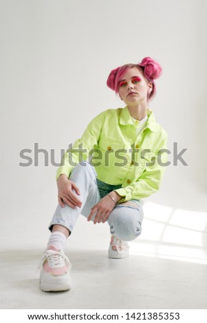 woman with pink hair sitting fashion style