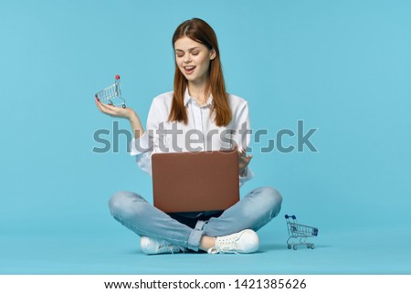 female student sitting with laptop studying