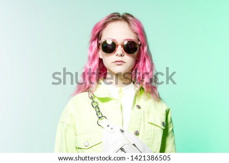 woman with pink hair in summer sunglasses