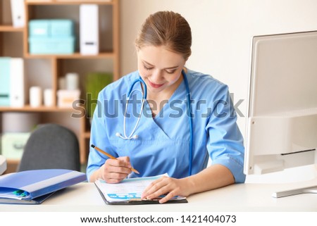 Young medical assistant working in clinic
