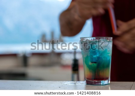 Summer rainbow layered cocktail -background