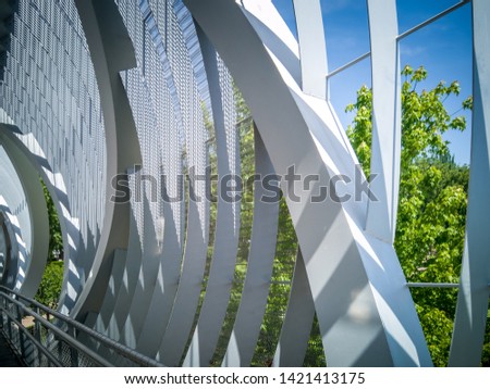 The Arganzuela footbridge. It is a modern metal bridge outdoors located in the Madrid Rio green park near Madrid beach and across the Manzanares river