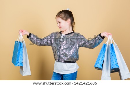 Fashion and style. customer with package. Sales and discounts. Small girl with shopping bags. Cheerful child. Little girl with gifts. retail. Holiday purchase saving. Pleased with choice.