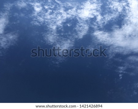 white clouds on a blue background in the afternoon
