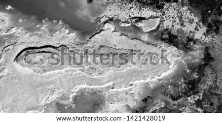 metastasis of the earth, black gold, polluted desert sand, black and white photo, abstract naturalism, photography of the deserts of Africa from the air, aerial view, abstract expressionism,