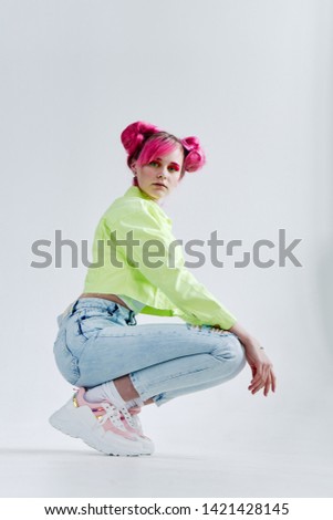 woman with pink hair sitting