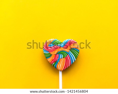 colorful lollipop On a yellow background. Sweet candies. Valentine's day elements.