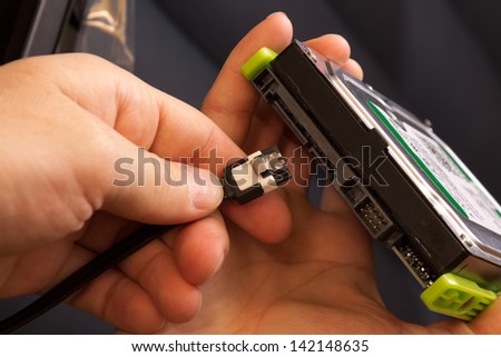 Plugging wire in to the hard disk drive