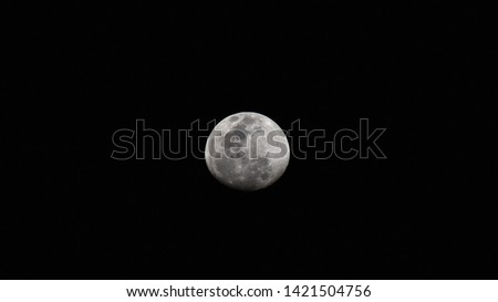 Picture of moon taken during night at lower aperture