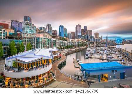 Seattle, Washington, USA pier and skyline at dusk. 