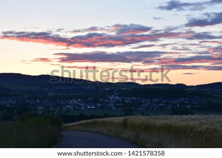 dusk landscape in rural green hills of the Eifel