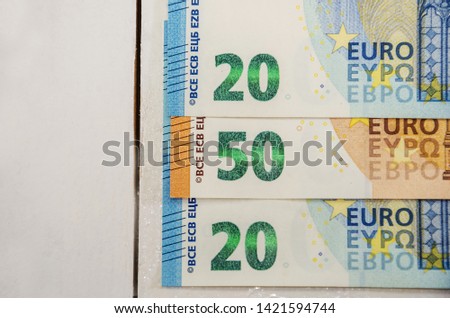 20 and 50 euro banknotes on a white background close up