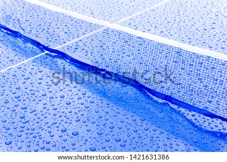 Table tennis. Table for tennis in raindrops. Ping pong outdoors