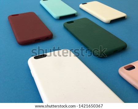 Pastel mobile phone case. Couple Cool Case For phone. Phone accessories. Colorful  plastic Phone cases on blue background