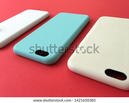 Pastel mobile phone case. Couple Cool Case For phone. Phone accessories. Colorful  plastic Phone cases on red background