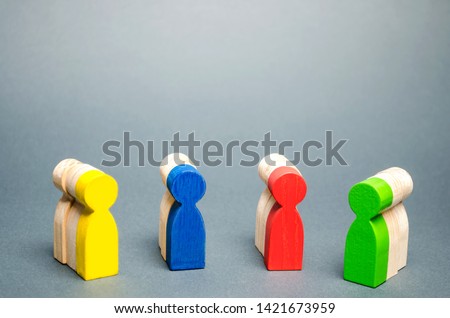Groups of multicolored wooden people. The concept of market segmentation. Customer relationship management. Target audience, customer care. Groups of buyers. Targeting. Segments Royalty-Free Stock Photo #1421673959