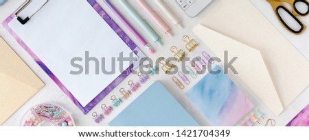 Flat lay and top view of stylish stationery pastel set for school or office. Back to school concept. Panoramic pastel background