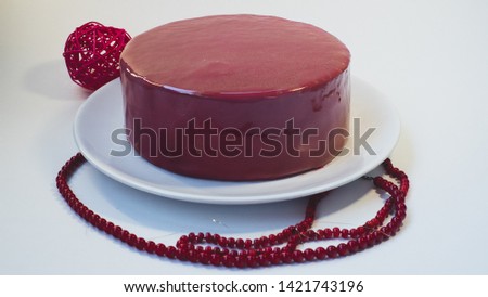 red icing cake on white background
