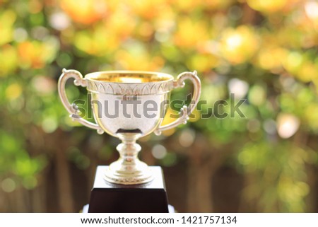 Close-up of trophies multicolored light as background selective focus and shallow depth of field
