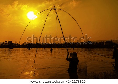 Fishing lifestyle net during sunset , thai