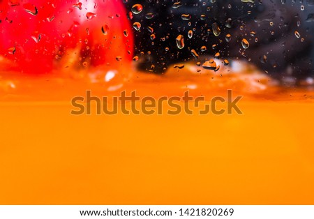 Close up still life of assorted red fruit under splash of water