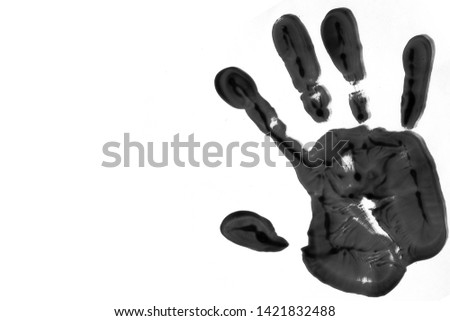 Black color handprint on a white background, depicting the idea of to stop violence against women, as palm symbol is used by the feminist movement