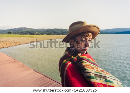 Pretty female boho lifestyle person in a bohemian and beautiful nature place