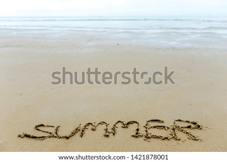 Summer writing on sand vacation