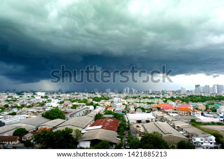 Pictures of the city during the daytime Weather in the sky with clouds, rain, storms