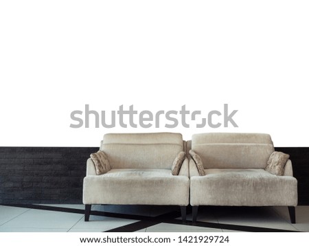 Twin grey velvet sofa bed on black brick and white wall background with copy space.