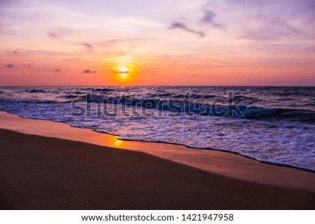 Silhouette of tropical beach during sunset twilight. Landscape of summer beach at sunset. Vacation background concept - Image 