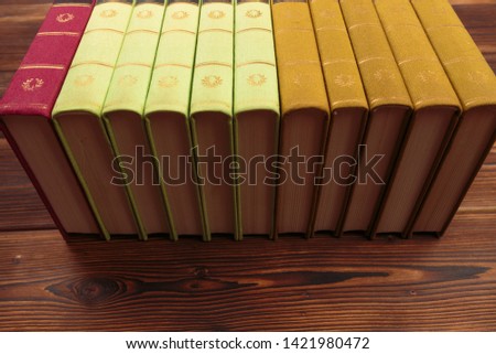 old books on the background of a wooden - Image 