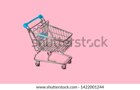 shopping cart  on the  pink background