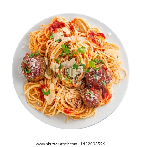 Spaghetti with meatballs, parmesan and tomato sauce on a plate. Tasty Italian pasta food. Top view shot above isolated on white background.