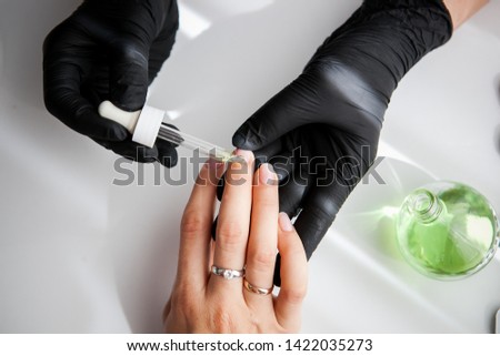 Manicure, Hands spa Cuticle oil. Beautiful Woman hands closeup. Manicured nails and Soft skin. Beauty hands. Beauty treatment. 