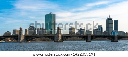panorama for banner of Train running over the Longfellow Bridge the charles river at the evening time, USA downtown skyline, Architecture and building with transportation concept