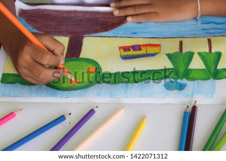Coloring with pencil colors. Kids are coloring educational concepts.