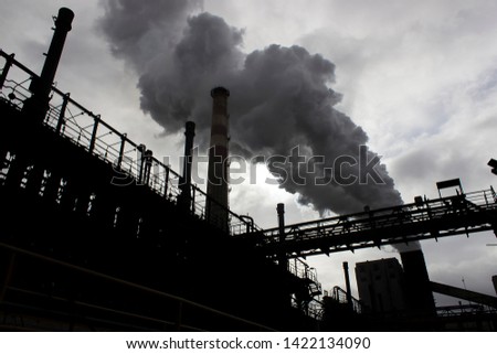 The smoke from factory chimney. Air pollution concept at heavy industry.