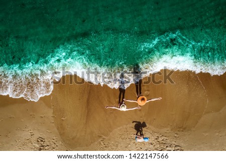 Summer photo of aerial veiw of beach and family . Free space for your decoration and warm sand with ocean landscape. 