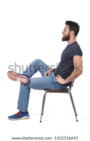 full portrait of a man sitting on a chair on white Royalty-Free Stock Photo #1422156641