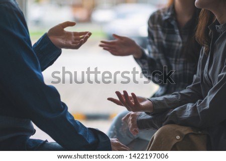 People sitting and talking together Royalty-Free Stock Photo #1422197006