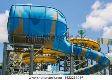 Slider and pool at waterpark in summer