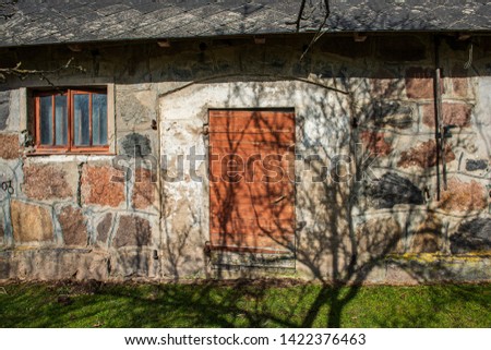 stone brick concrete building details in green countryside landscape