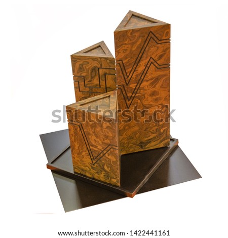 Geometric shapes still life composition. Three-dimensional prism a pyramid of three high triangles made of granite on an isolated background. The simplicity of the concept pictures