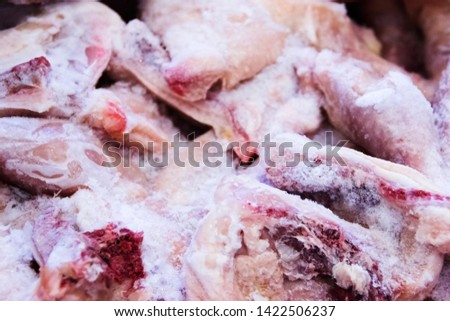 pictured in the photo Frozen raw chicken, background