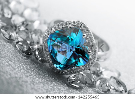  Various Jewelry gem stones on grey background Royalty-Free Stock Photo #142255465