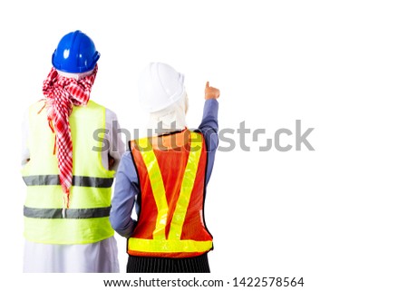 Backside of engineer man and woman wearing safety uniform and standing with isolated background.