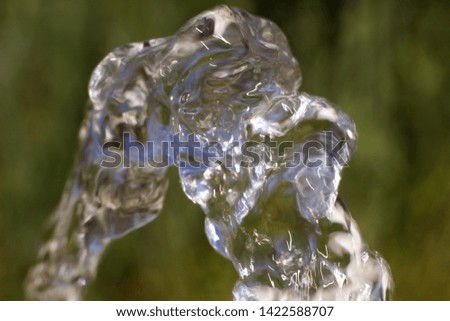  flow of pure spring water on a natural background